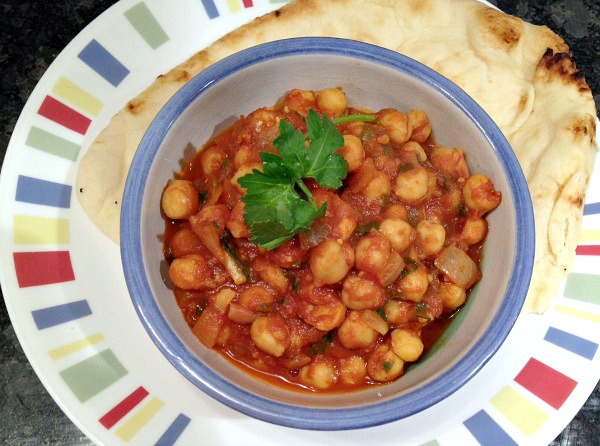 Easy spicy curried chickpeas -- a quick and simple recipe you can enjoy as either a vegetarian main dish or as a hearty side dish.