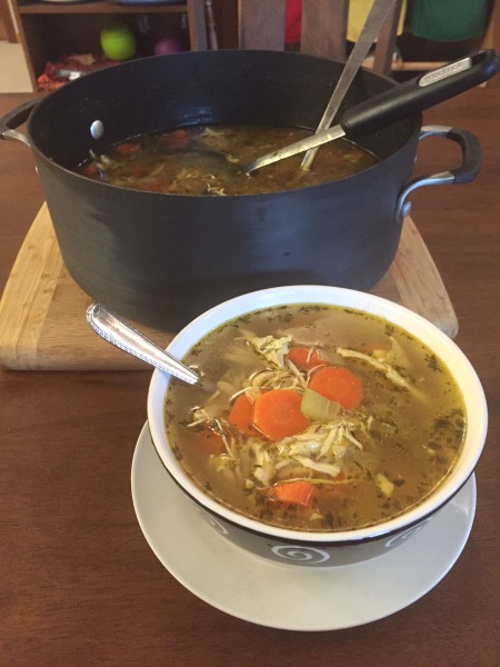 pot and bowl of chicken soup