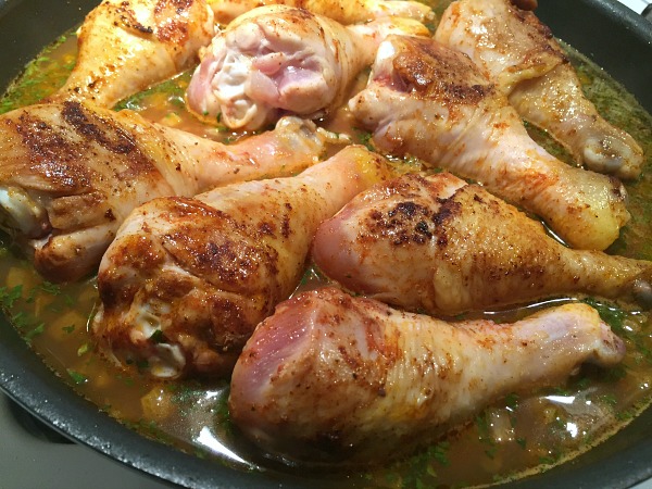 drumsticks in pan with broth