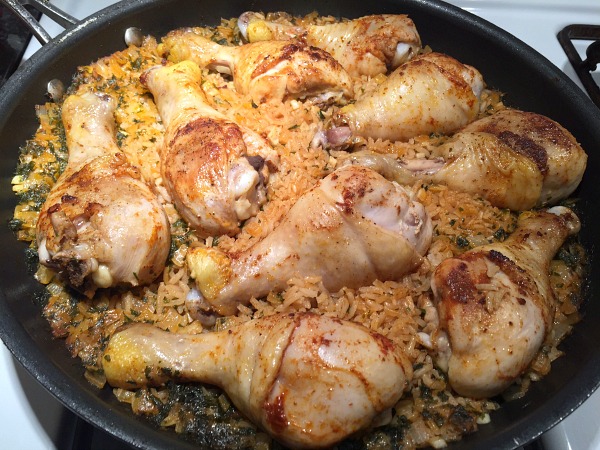 cooked drumsticks and rice in pan