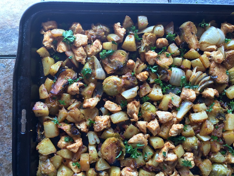sheet pan full of brussels chicken and potatoes