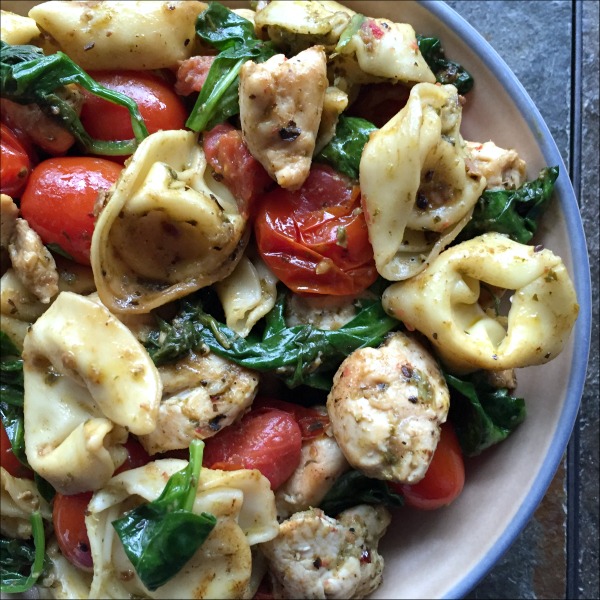 This pesto tortellini with chicken, spinach, and tomatoes recipe is super flavorful, especially considering how few ingredients you're actually using here!