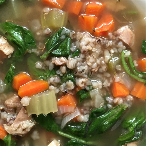 bowl of leftover turkey soup with spinach