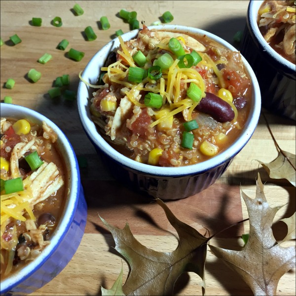 bowls of quinoa chicken chili with cheese