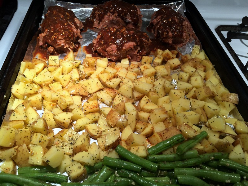 Ready to cook turkey meatloaf dinner on a sheet pan.