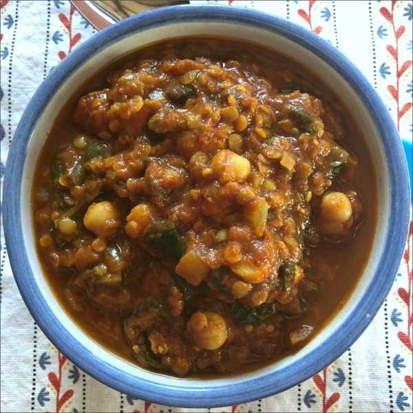 This simple slow cooker vegetarian chickpea lentil stew is a warm and welcoming choice for a chilly winter's night: The perfect vegan comfort food! Serve over pasta, potatoes, rice, or quinoa for a complete meal.