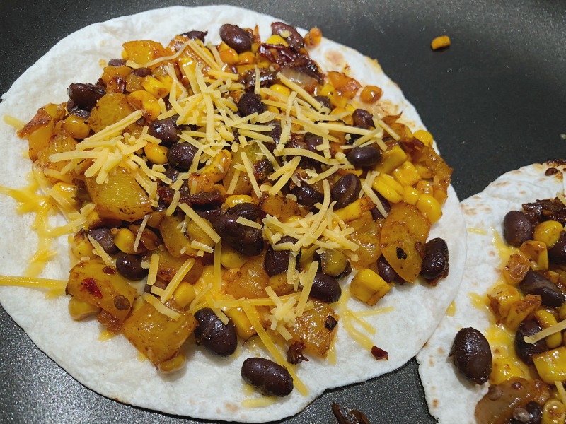 These filling chipotle quesadillas with pan-roasted veggies and black beans make a simple and flavorful vegetarian dinner when paired with a little guac, salsa, and a salad or green vegetable side!