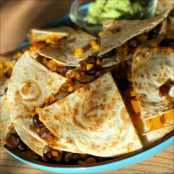 These filling chipotle quesadillas with pan-roasted veggies and black beans make a simple and flavorful vegetarian dinner when paired with a little guac, salsa, and a salad or green vegetable side!