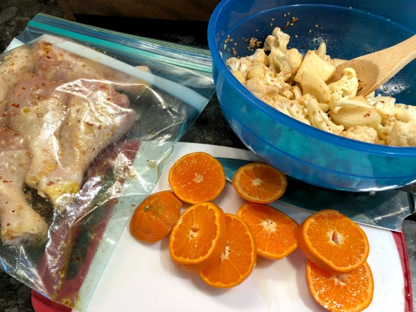 chopping clementines and cauliflower