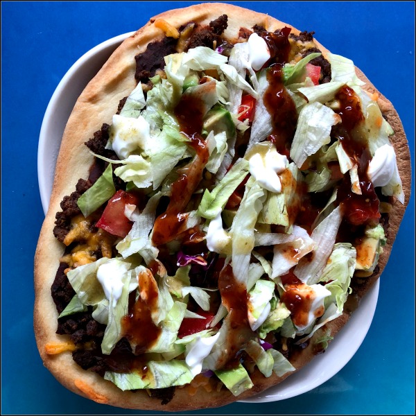 plate of taco naan pizza