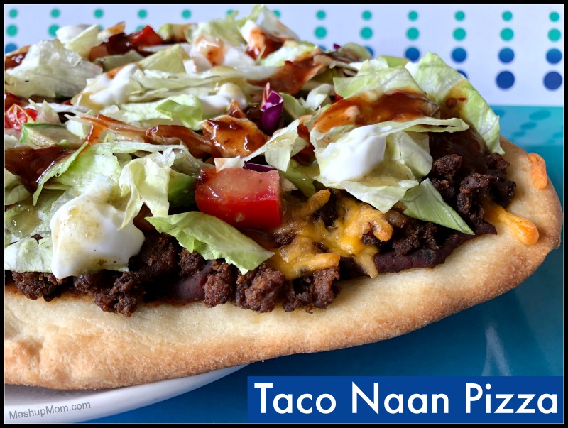 taco naan pizza with lettuce and taco sauce
