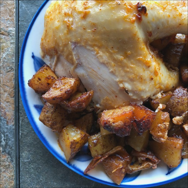 plate of chicken and potatoes