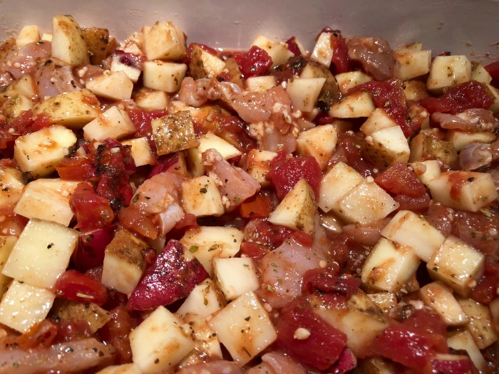 chicken and potatoes in baking dish