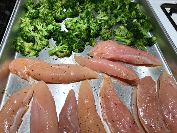 chicken and broccoli on baking sheet
