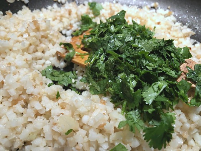 add cilantro to cauliflower rice