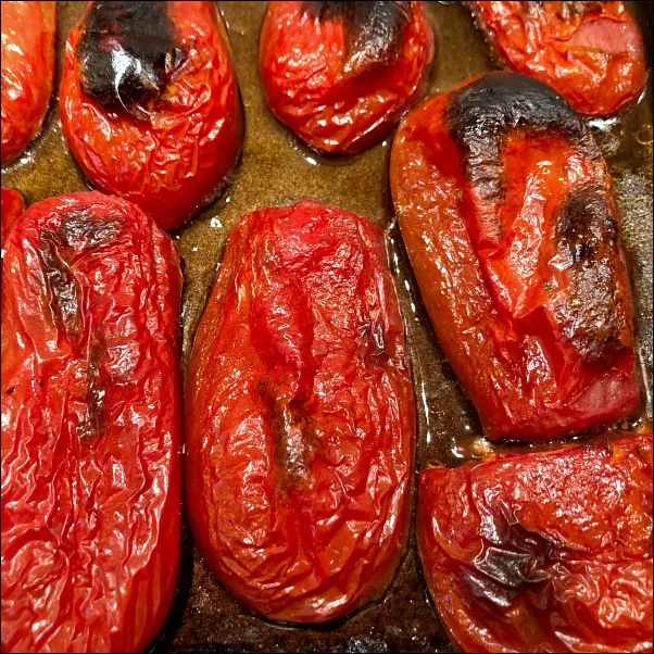 fire roasted tomatoes on cookie sheet