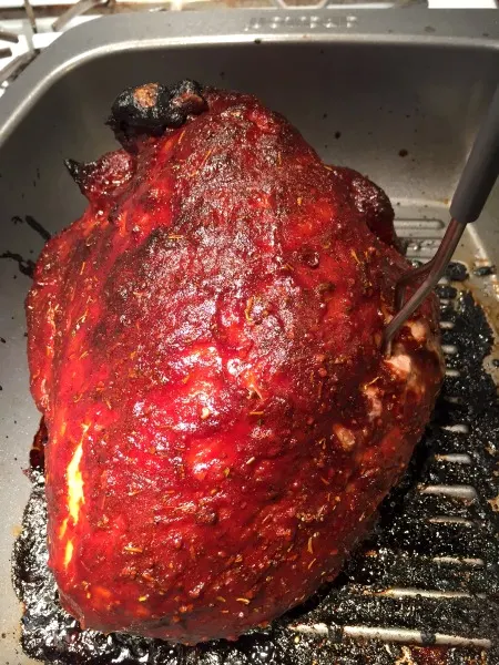 whole roasted BBQ turkey breast in a pan