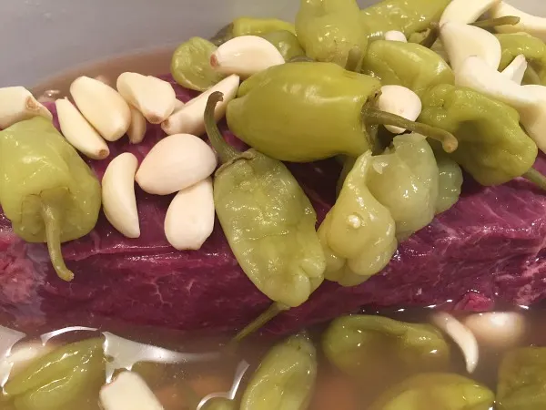 beef in slow cooker with peppers and garlic