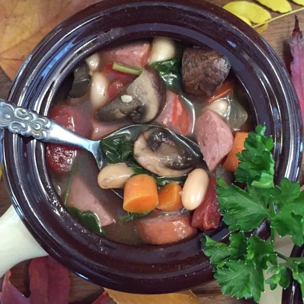 Bowl of sausage and spinach soup