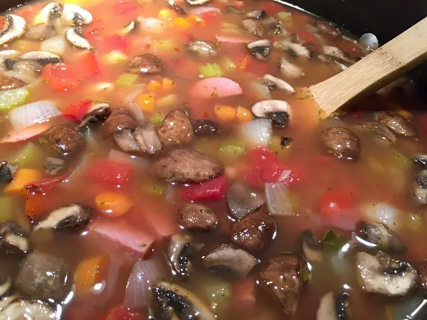 pot of soup ready to wilt in spinach