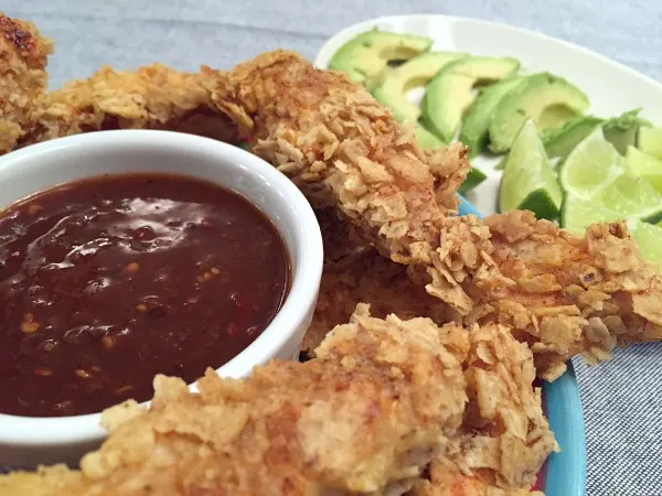 plate of chicken fingers and sauce