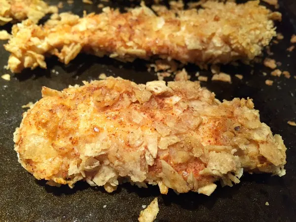 chicken fingers on baking sheet