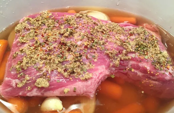 corned beef over veggies in slow cooker