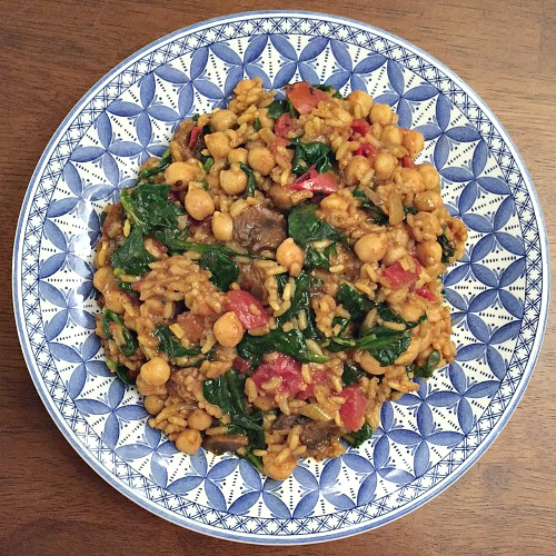 plate of curried chickpeas with rice and spinach