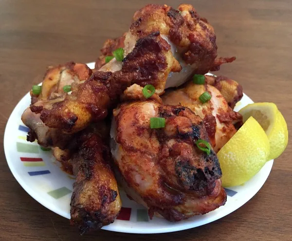 plate of flavorful chicken drumsticks