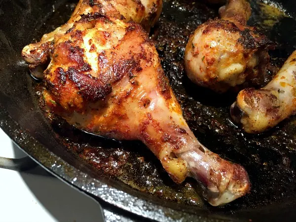 browned drumsticks in the skillet