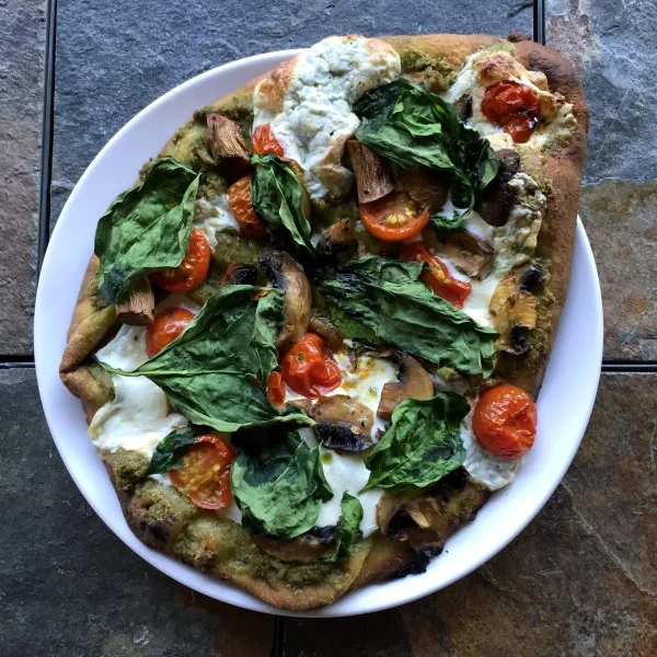 plate of naan pesto pizza