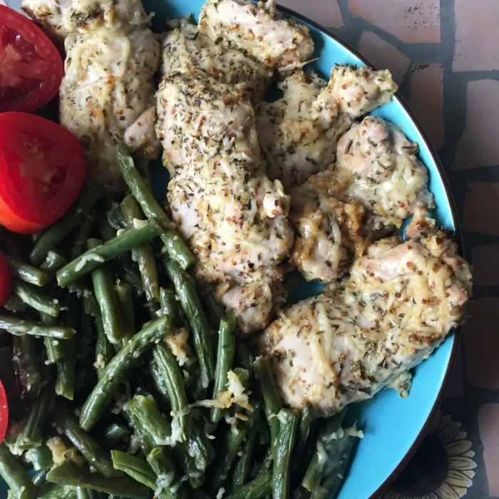 parmesan chicken thighs on a plate