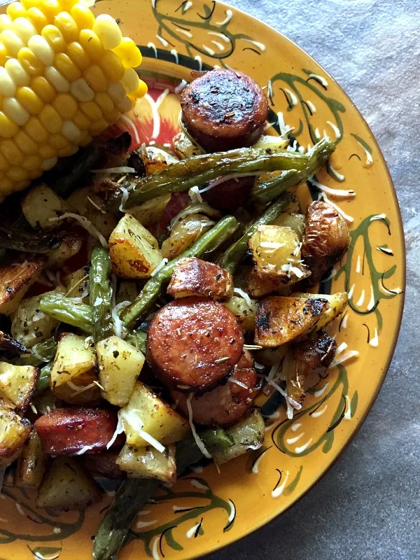 plate of sheet pan sausage, green beans, and potatoes