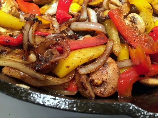 Easy steak fajitas with onions, pepper, and mushrooms -- Gluten free (use GF tortillas) and low carb (use a low carb wrap)!