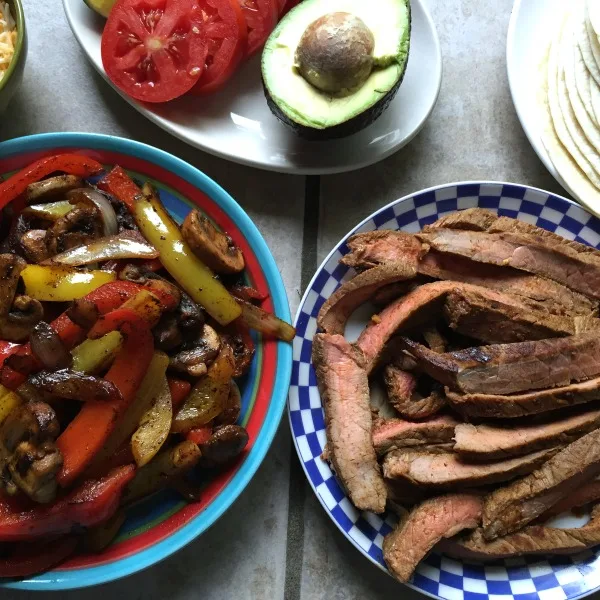 Easy steak fajitas with onions, pepper, and mushrooms -- Gluten free (use GF tortillas) and low carb (use a low carb wrap)!