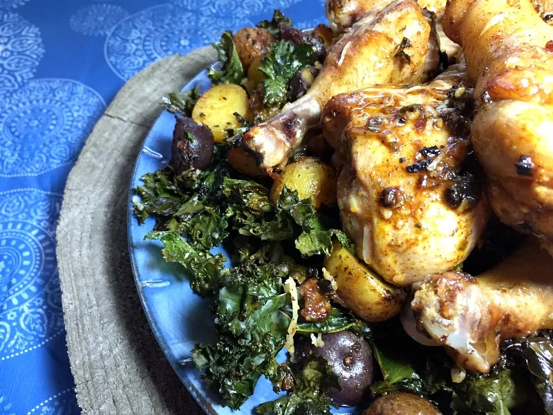 Sheet Pan Chili-Lime Chicken Drumsticks with Baby Potatoes and Crispy Kale -- A flavorful one pan meal! Naturally gluten free.
