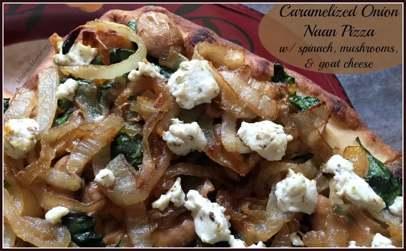 Caramelized onion naan pizza with spinach, mushrooms, and goat cheese