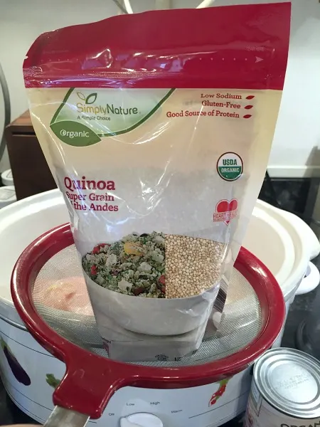 strain quinoa in a fine mesh strainer