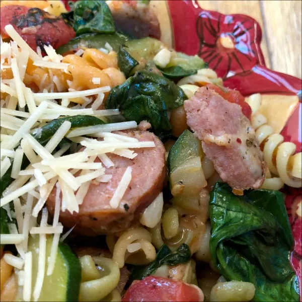 Smoked sausage, zucchini, and spinach pasta is a filling all-in-one weeknight dinner that’s just jam packed with flavor. Mash up the salty goodness of Parmesan-roasted zucchini with the smoky flavor of kielbasa + fire roasted tomatoes to create a savory pasta dish the whole family will enjoy.
