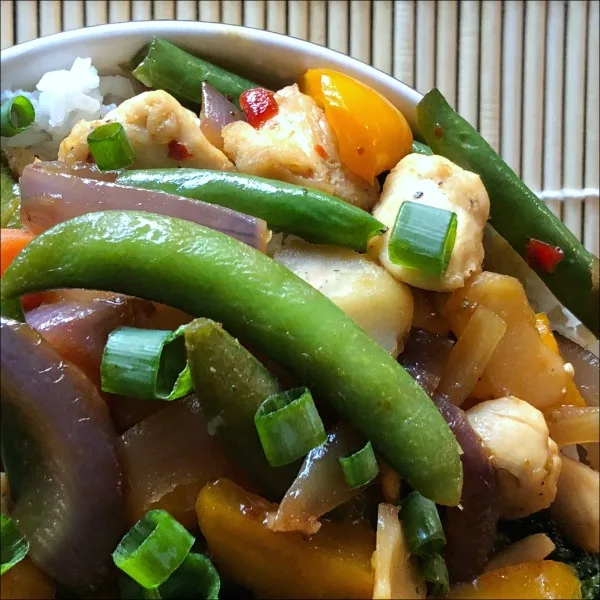 How about an easy 30 minute weeknight dinner recipe: Sweet & Tangy Chicken Vegetable Stir Fry! Red pepper jelly adds a sweet underlying tang to this easy 30 minute stir fry recipe, which complements both the salty soy and the slight kick from the red pepper flakes and ginger.