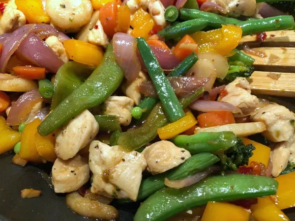 How about an easy 30 minute weeknight dinner recipe: Sweet & Tangy Chicken Vegetable Stir Fry! Red pepper jelly adds a sweet underlying tang to this easy 30 minute stir fry recipe, which complements both the salty soy and the slight kick from the red pepper flakes and ginger.