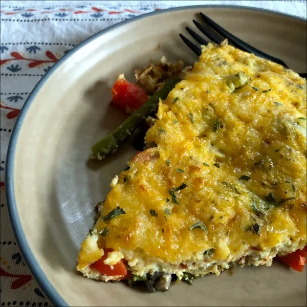 Chock full of veggies + Italian flavor, this vegetable ricotta frittata is a filling vegetarian choice for your Meatless Monday, or for any quick weeknight dinner. Italian veggie ricotta frittata is naturally low carb and gluten free.