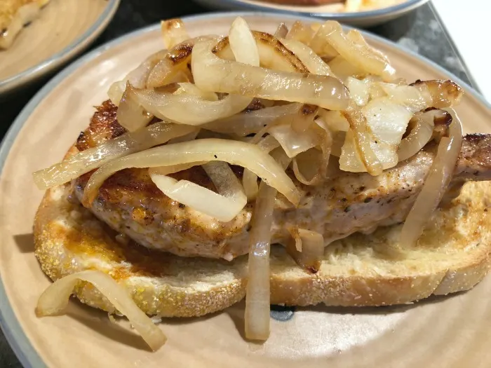 assemble pork chop sandwiches with onions