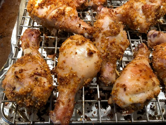 Tonight, why not shake up your normal chicken drumsticks recipe routine with these {title}? If you like garlic, you'll probably like this affordable and kid-friendly recipe for easy, cheesy, garlicky good chicken drumsticks!