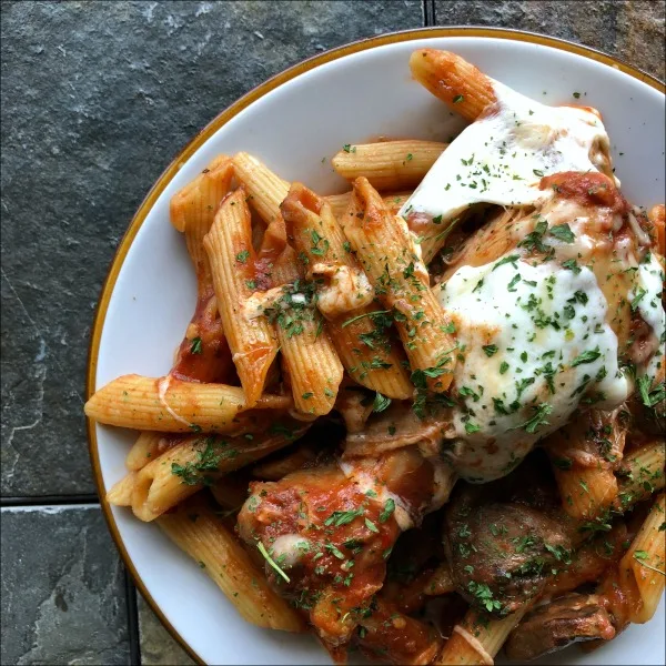 This Slow Cooker Chicken Drumsticks Marinara Mozzarella Mushroom Mish-Mosh (with Penne Pasta!) is such an easy family recipe, and a big step up from your basic pasta and sauce. Your Crock-Pot slow cooks the drumsticks to perfect fall-apart tenderness, while cooking in marinara keeps them moist and savory. Mozzarella and Parmesan cheeses add a salty tang and creaminess to balance out the acidity of the tomato sauce, in a brilliant mish-mosh-mashup of flavor. 