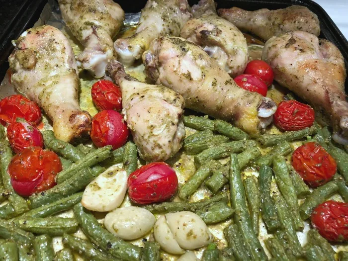 pesto drumsticks on a pan