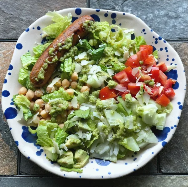 plate of chicken sausage dinner salad