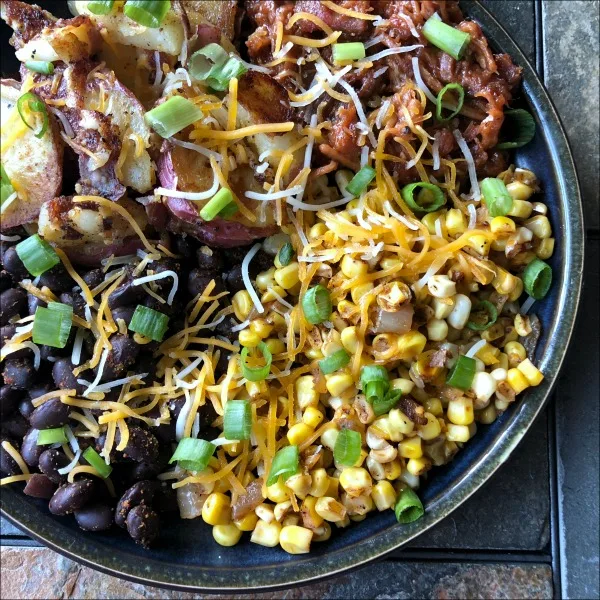 Leftovers for the win today: Not bad for an all-in-one 30 minute weeknight dinner recipe! Southwest Pulled Pork and Potato Bowls are naturally gluten free comfort food in a bowl. Try this easy leftover pulled pork recipe the next time you have some on hand. | MashupMom.com bowl of pulled pork and potatoes