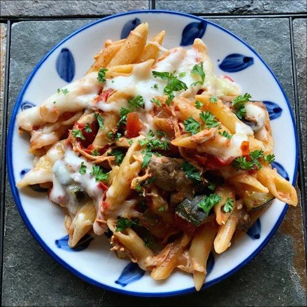 plate of pasta with chicken and veggies