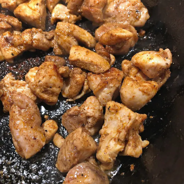 seasoned chicken in a skillet